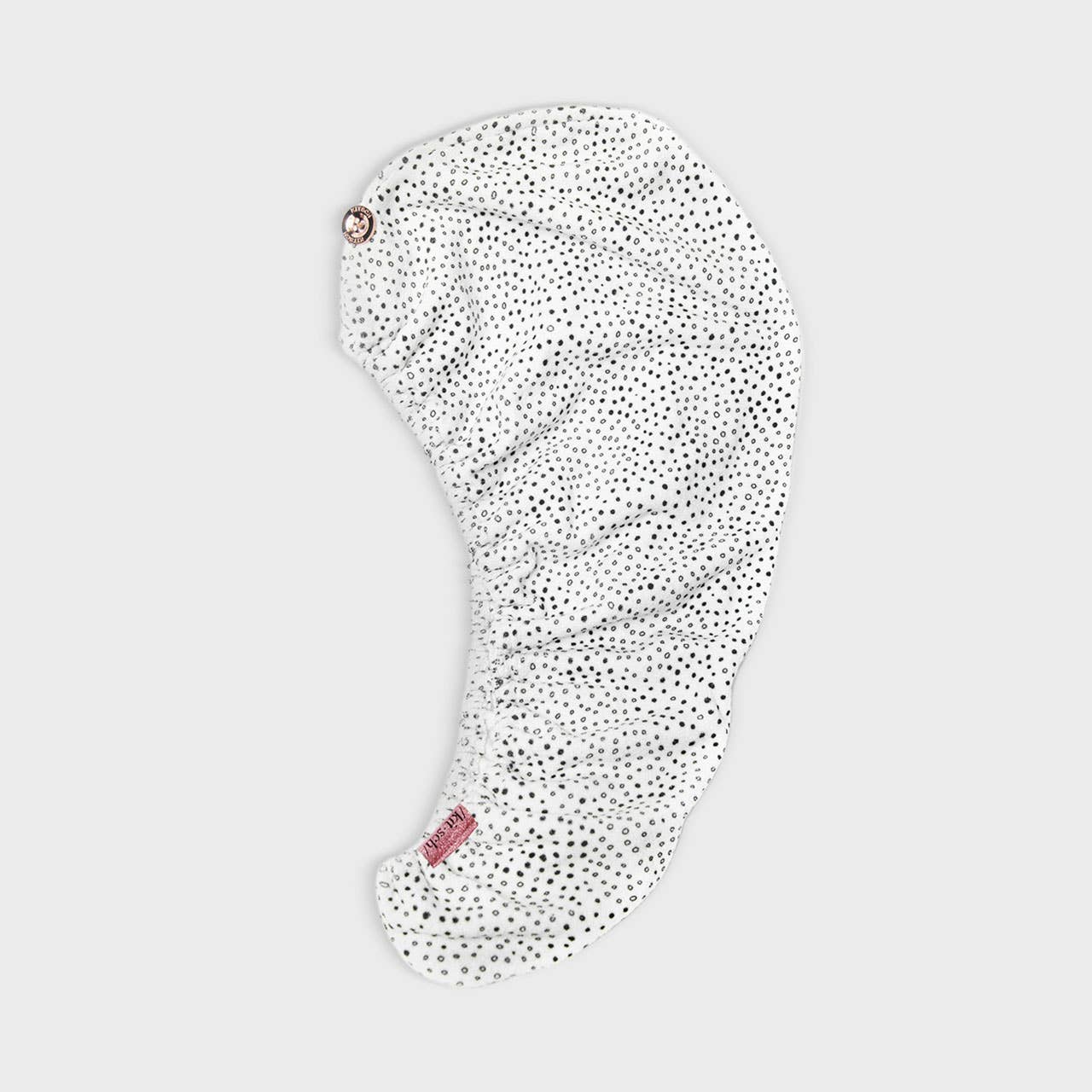 hair towel with black polka dots on a light gray background