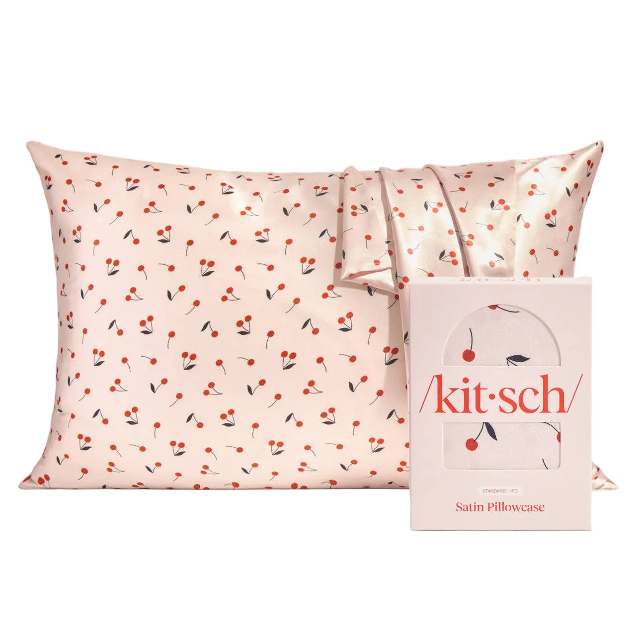 Satin pillowcase with cherry pattern and 'kitsch' packaging on a white background