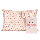 Satin pillowcase with cherry pattern and 'kitsch' packaging on a white background