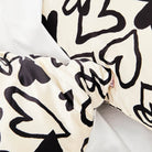 Silk scarf with black abstract patterns on a white background