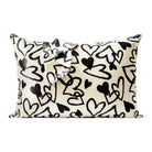 Pillow with black heart pattern on a white background