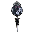 A novelty wine bottle stopper featuring a circular black insert with a black-and-white photo of Marilyn Monroe and pink text, topped with a silver metallic floral crown and a silver pointed stopper below.