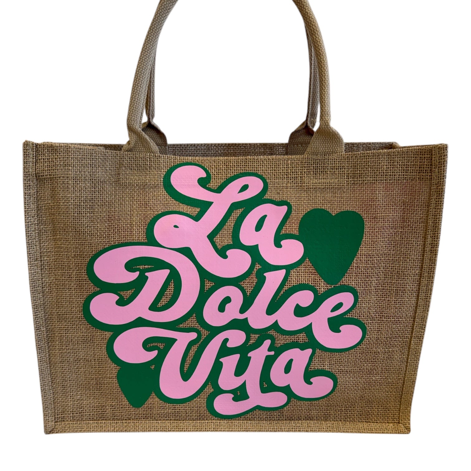 Jute bag with 'La Dolce Vita' text in pink and green on a white background