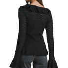 Black textured long-sleeve top worn by a person on a white background