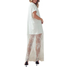 White dress with lace overlay worn by a model on a white background