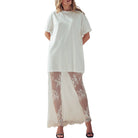 White dress with lace overlay worn by a model on a white background