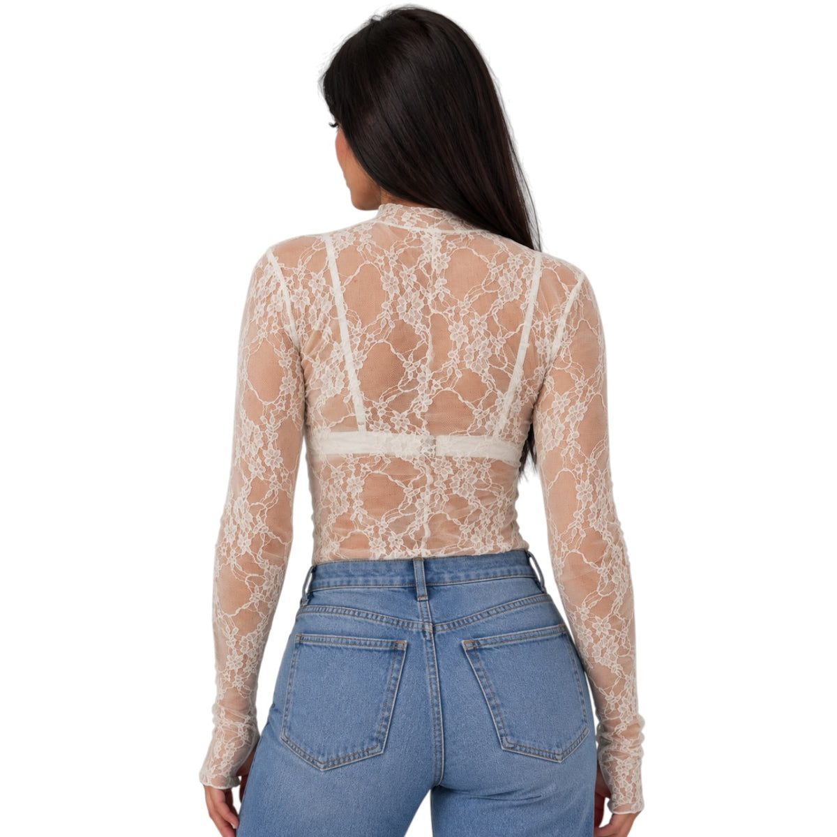 A woman viewed from the back wearing a sheer beige lace long-sleeve crop top and light blue jeans against a plain white background.