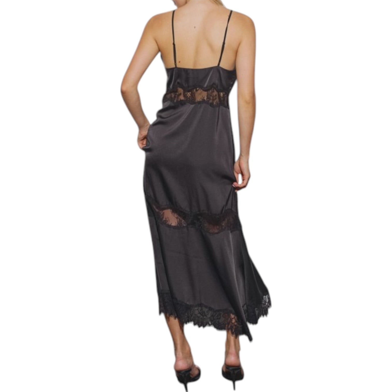 Woman wearing a black lace dress on a white background