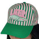 Green and pink striped cap with alligator graphic and 'Alligator' text on a white background