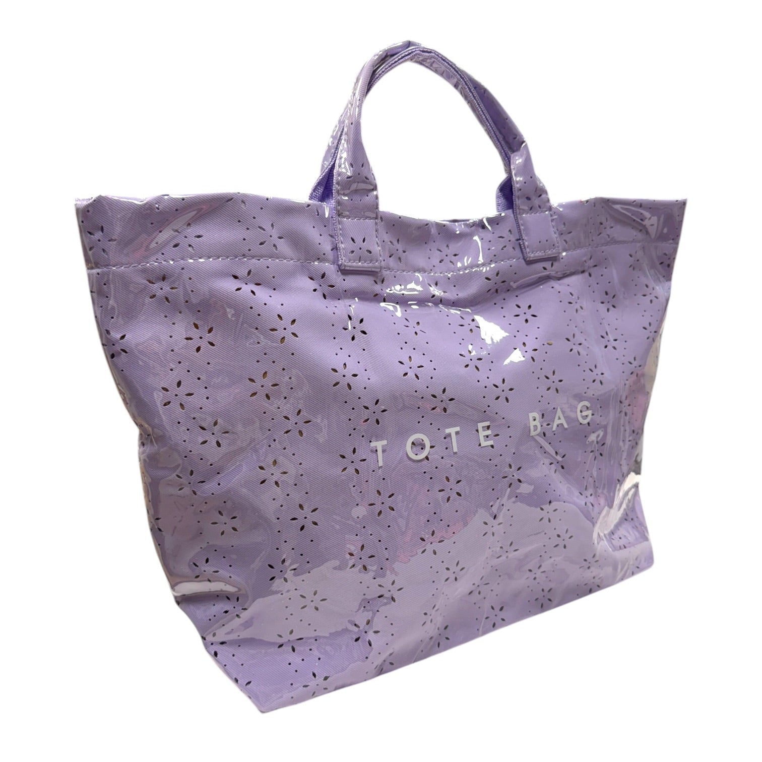 Purple tote bag with cut-out pattern and 'TOTE BAG' text on a white background