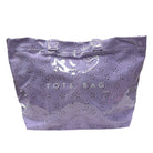 Purple tote bag with star patterns on a white background