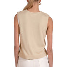Beige sleeveless knit top worn by a person on a white background