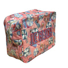 Pink beach bag with 'LE BEACH' text and umbrella pattern on a white background