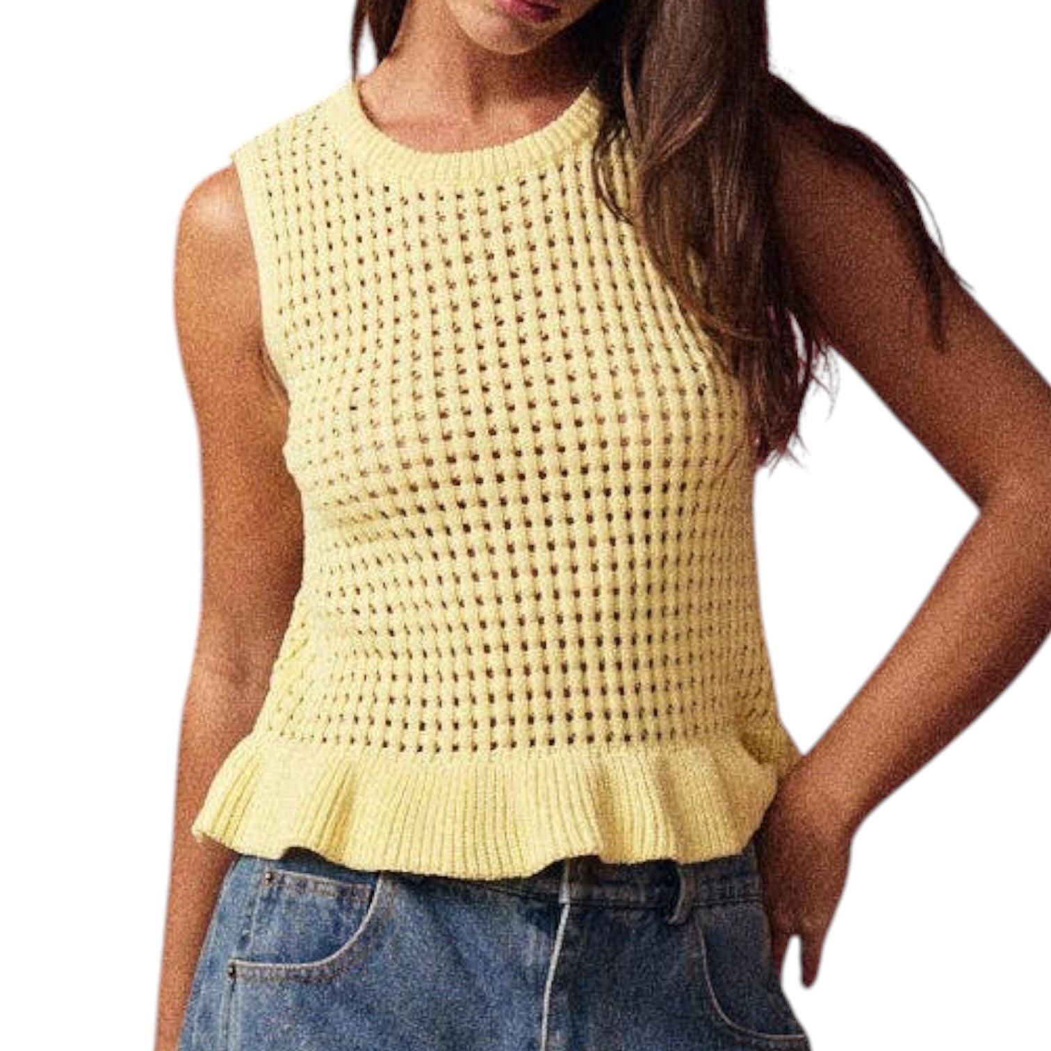 Woman wearing a yellow sleeveless knitted top with a plain background