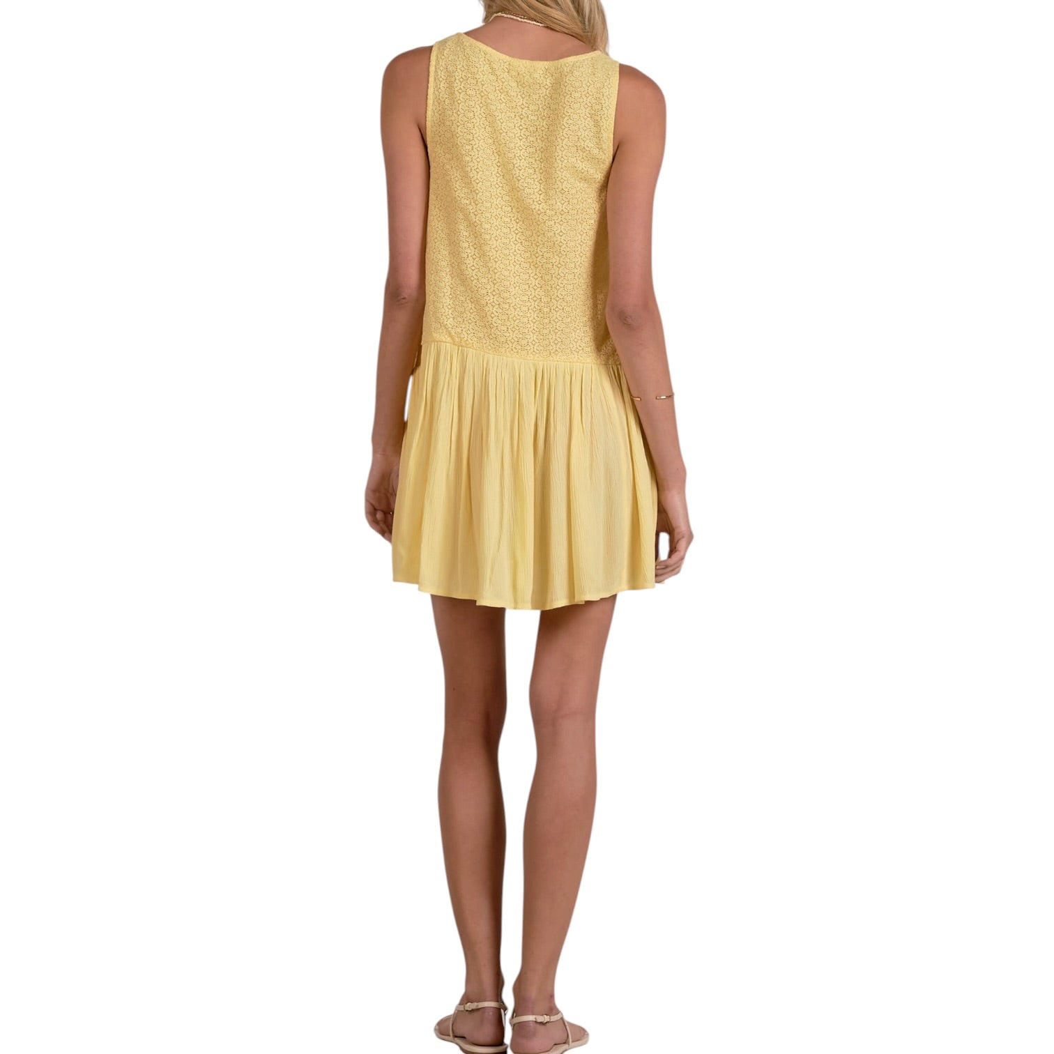 Yellow dress worn by a person on a white background
