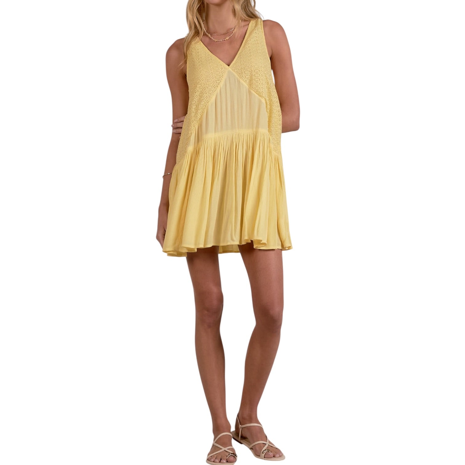 Woman wearing a yellow dress on a white background