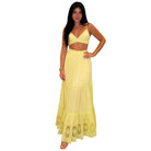 Woman wearing a yellow skirt set with a white background