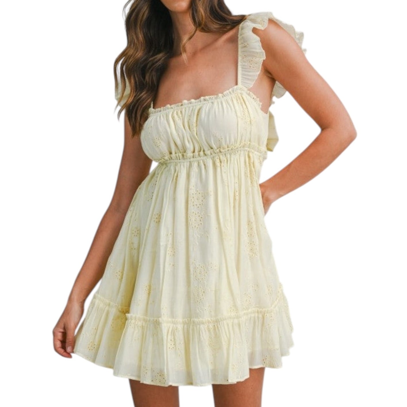 Woman wearing a light yellow dress on a white background