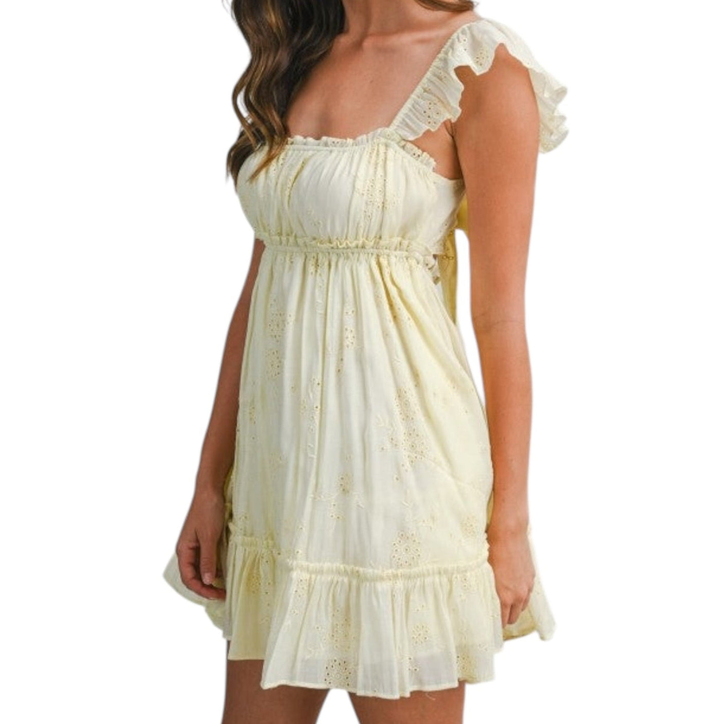 Woman wearing a white lace dress on a white background