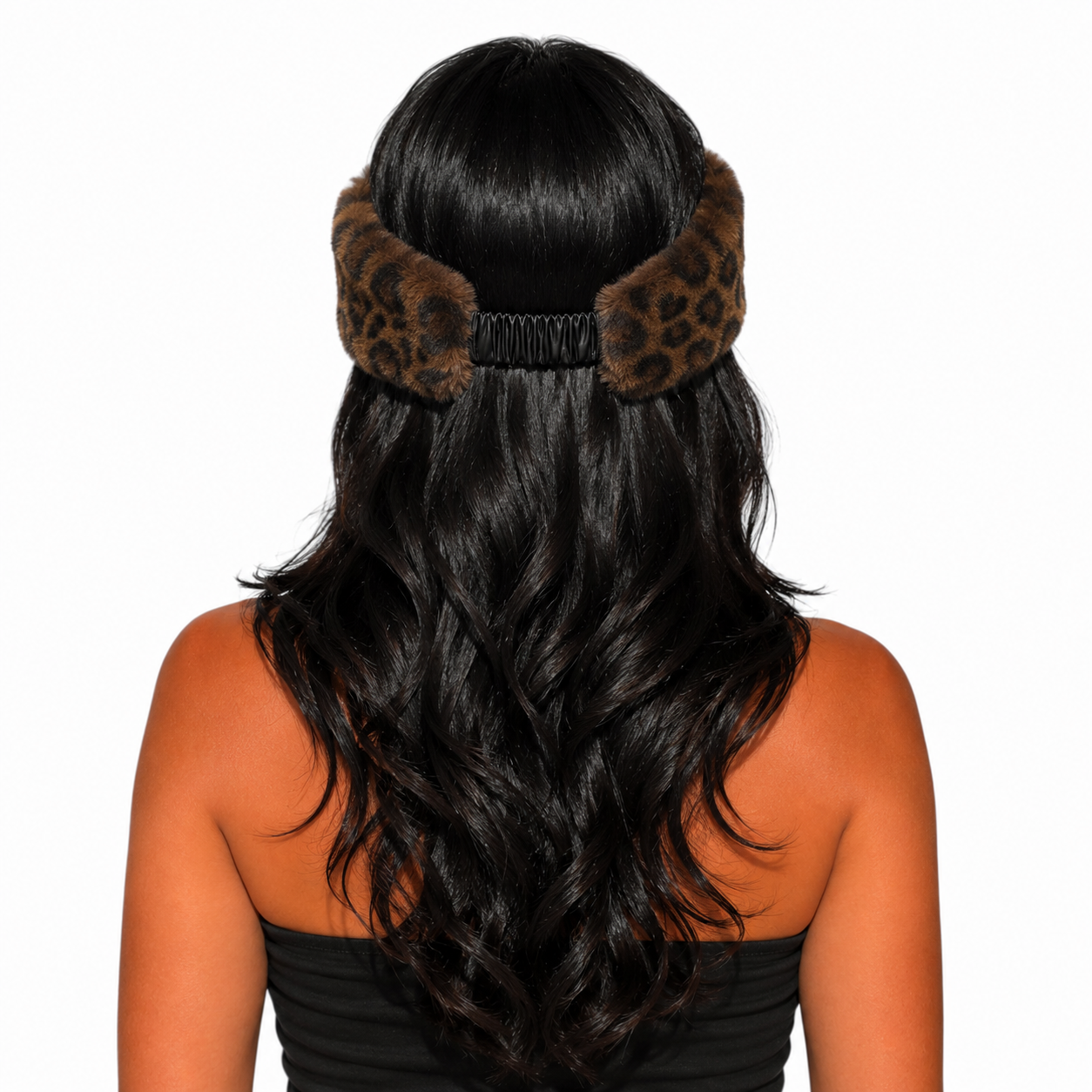 A woman shown from the back wearing a leopard-print hair accessory with fluffy ear-like sections and a black elastic band, against a plain white background.