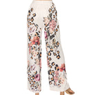 Floral and leopard print pants on a white background