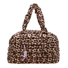 A plush, quilted leopard-print handbag with dual top handles and a dangling beaded keychain charm, shown against a plain white background.