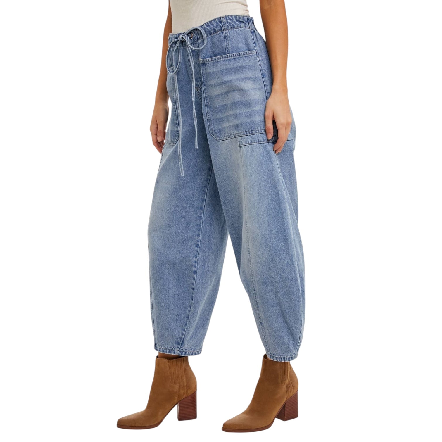 Blue jeans worn by a person on a white background