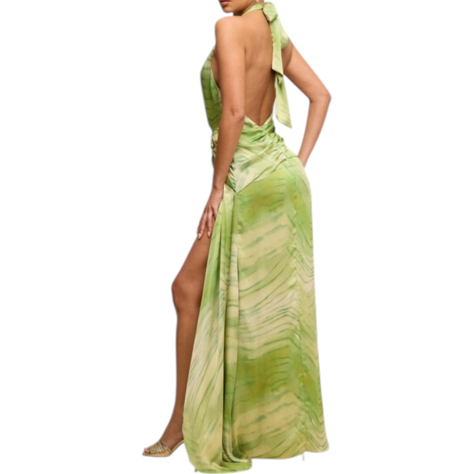 Green evening gown with open back and slit on a white background