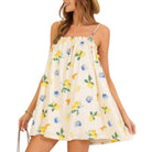 Woman wearing a white dress with lemon print on a white background