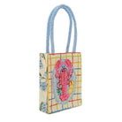 Handbag with a colorful design featuring a pink lobster on a white background