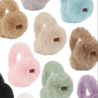 Long faux fur ear muff warmers in neutral tones, cozy winter accessory.