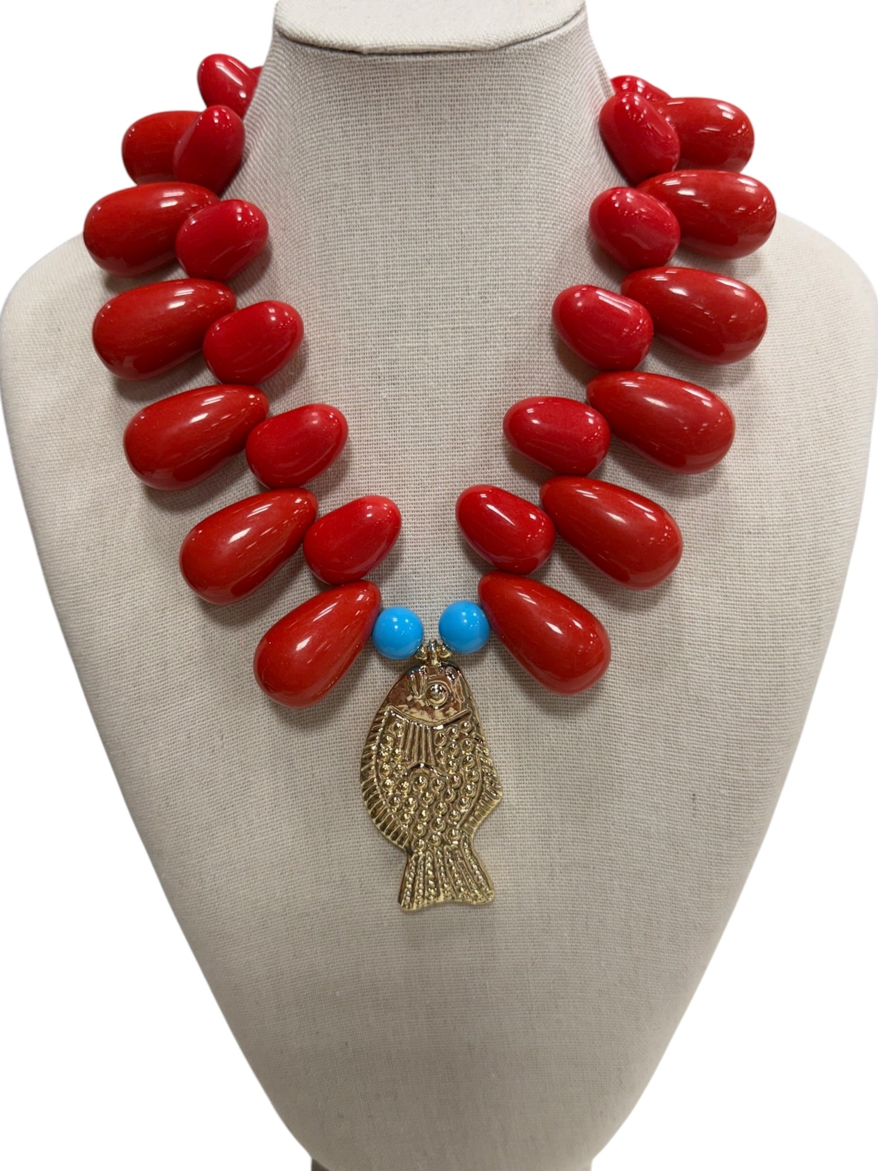 resin beaded fish necklace on white background