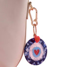 Keychain with a heart design on a beige background