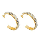 Gold hoop earrings with clear gemstones on a white background