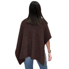 Woman wearing a brown poncho
