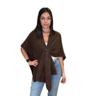 Woman wearing a brown poncho
