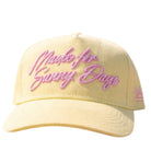Yellow cap with pink text on a white background