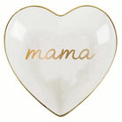 Heart-shaped white dish with gold rim and 'mama' text on a white background