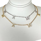 Necklace with letter charms on a mannequin bust