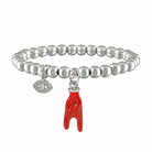 Silver beaded bracelet with a red foot charm on a white background