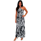 Woman wearing a black and white tie-dye dress on a white background