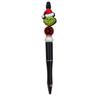Pen with Grinch face design on a white background