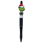 Pen with Grinch character and Santa hat on a white background