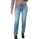 Light blue jeans worn by a person on a white background