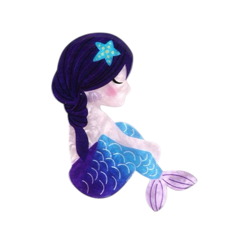 Mermaid plush toy with blue and purple tail on a white background