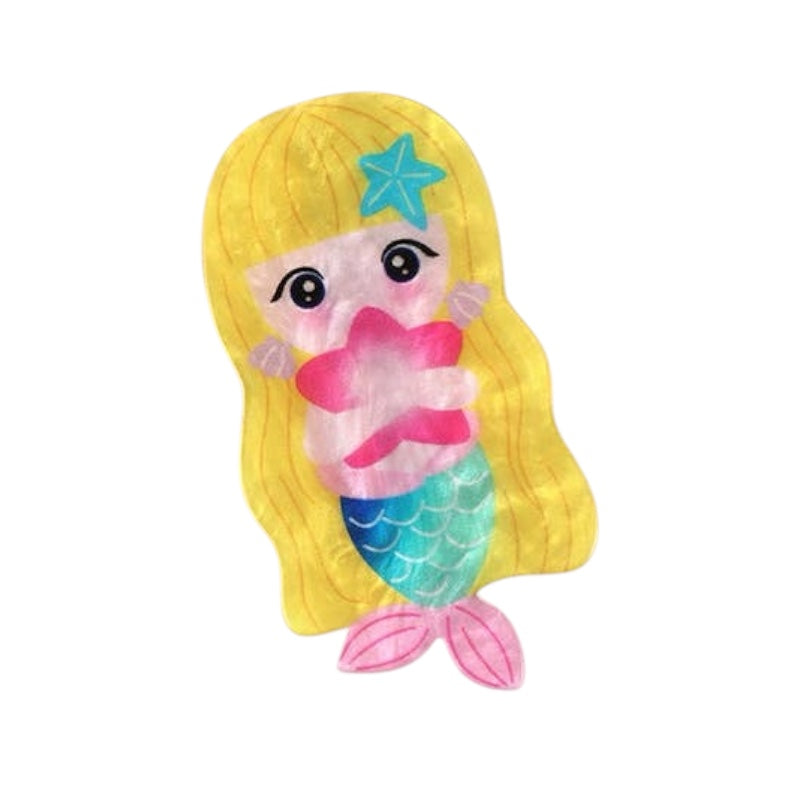 Mermaid toy with blonde hair, blue starfish, pink and green tail on a white background