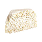 Beige purse with scales on a white background