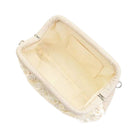 Purse with a tan interior on a white background