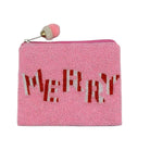A pink beaded zippered pouch featuring the word 'MERRY' in red and white beaded letters, with a pink and white pom-pom charm on the zipper pull, set against a plain white background.