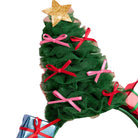 A festive Christmas tree headband featuring a green ruffled burlap tree with pink and red ribbon bows, topped with a glittery gold star, with wrapped gift boxes at the base, shown against a plain white background.